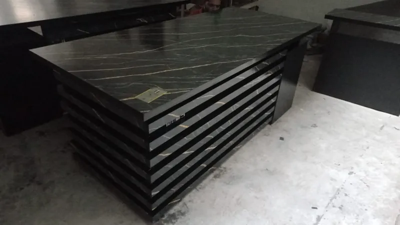 Black marble finish executive table with layered slat front, made by Lahore Carpenter in Lahore