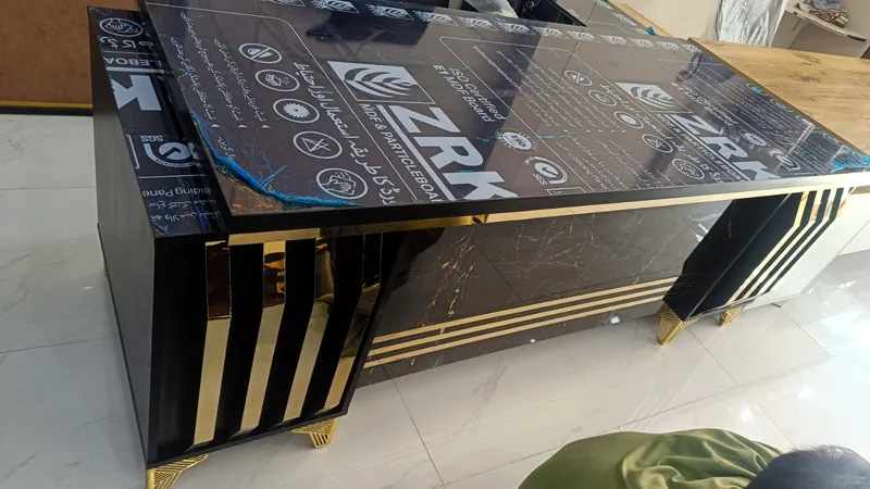 Executive table with gold stripe panels and marble front, ready for delivery, made by Lahore Carpenter in Lahore