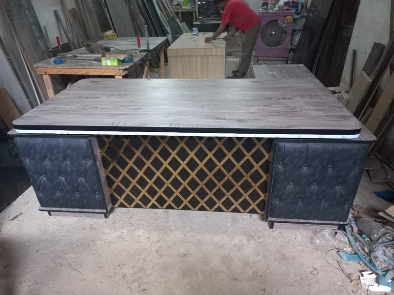 Executive table with tufted side panels and gold lattice front, made by Lahore Carpenter in Lahore