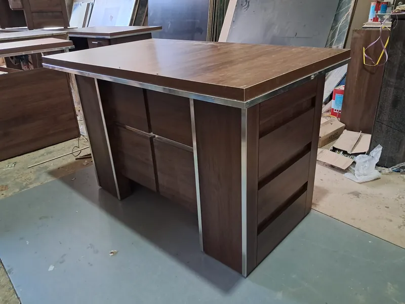 Walnut office table with steel trim and side drawers, made by Lahore Carpenter in Lahore